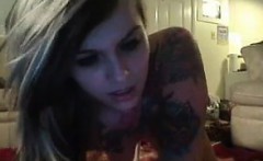 Tattooed hottie rides dildo on her pussy