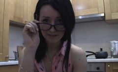 Splendid teen with glasses chatting in the kitchen