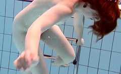 Underwater swimming teenie Lenka gets naked