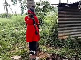 indian girl tied to a tree