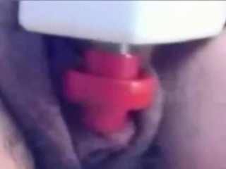 a woman pumps her clit into a dick