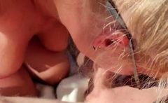 Sucking a big cock outdoors on a sunbed.